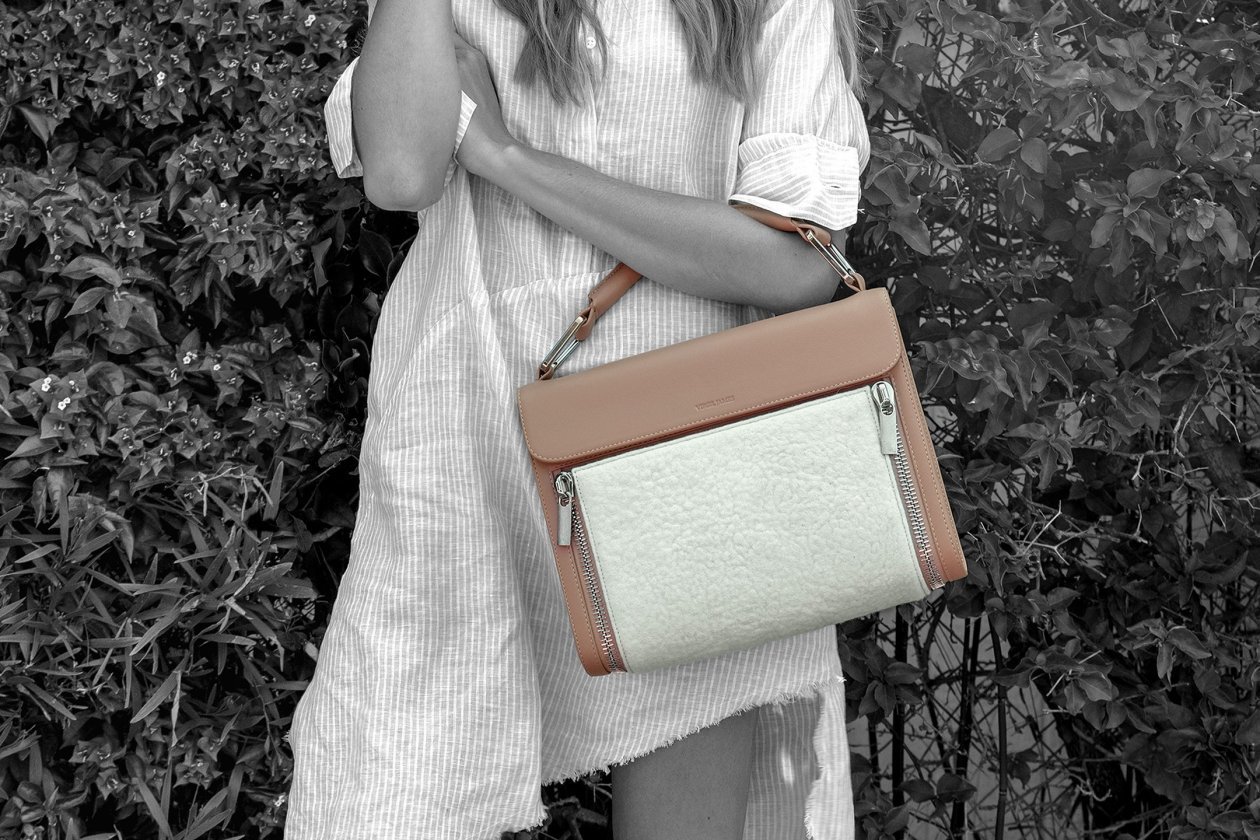 This Naturale Classic bag features a removable white cashmere felt panel, handmade in Mongolia for Virgil James.