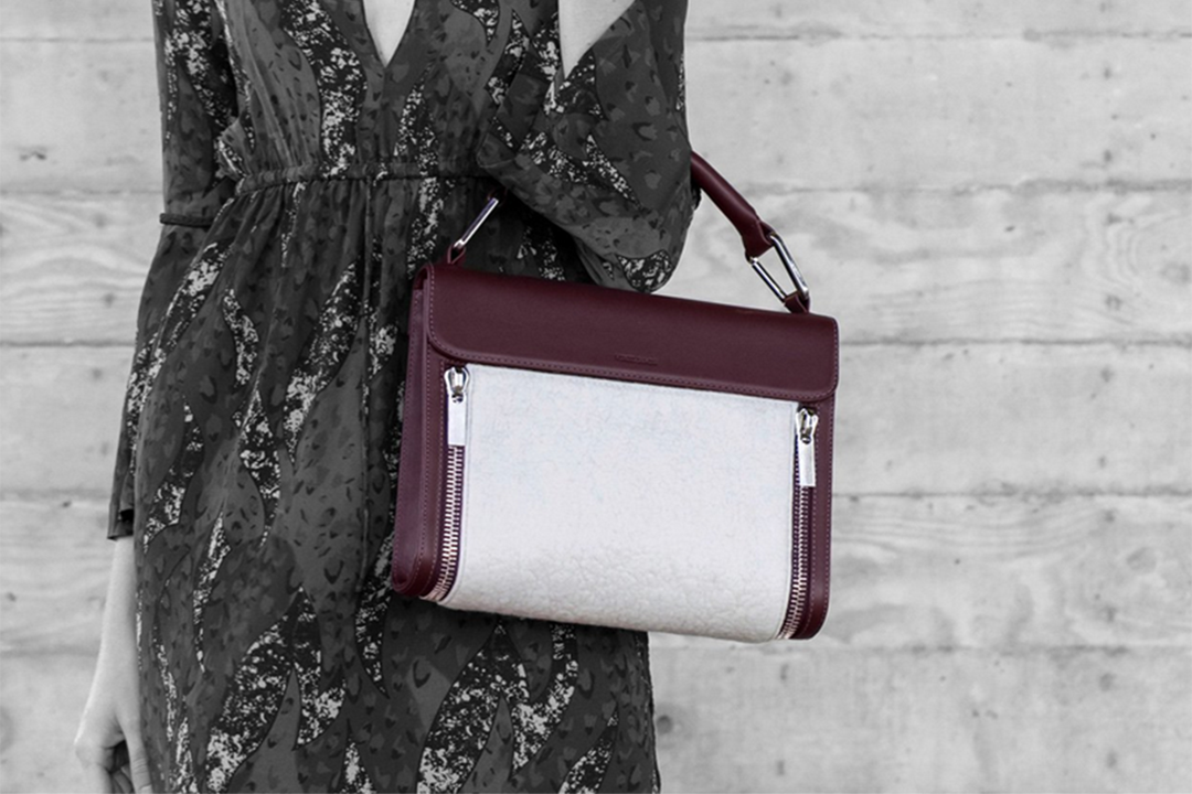 This Pruna Classic bag features a removable white cashmere felt panel, handmade in Mongolia for Virgil James.