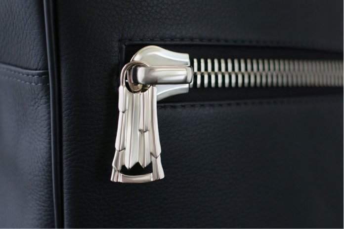 This handmade bonze zipper pull, finished in brushed nickel, is quality defined.